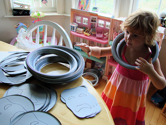 child with theatre masks