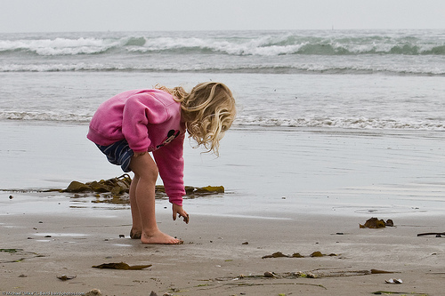 child playing on the beach